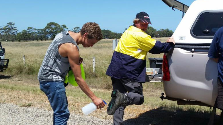 Spraying boots to clean them